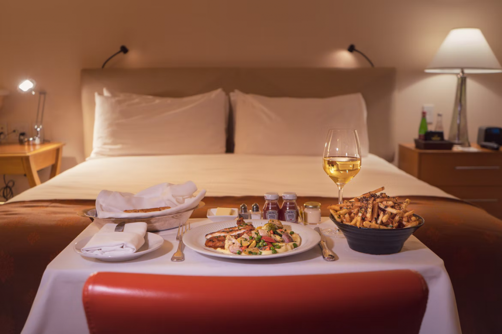 Room service is usually delivered by hotel staff on a cart, but some properties also offer in-room dining, where food is brought directly to the guest's door.